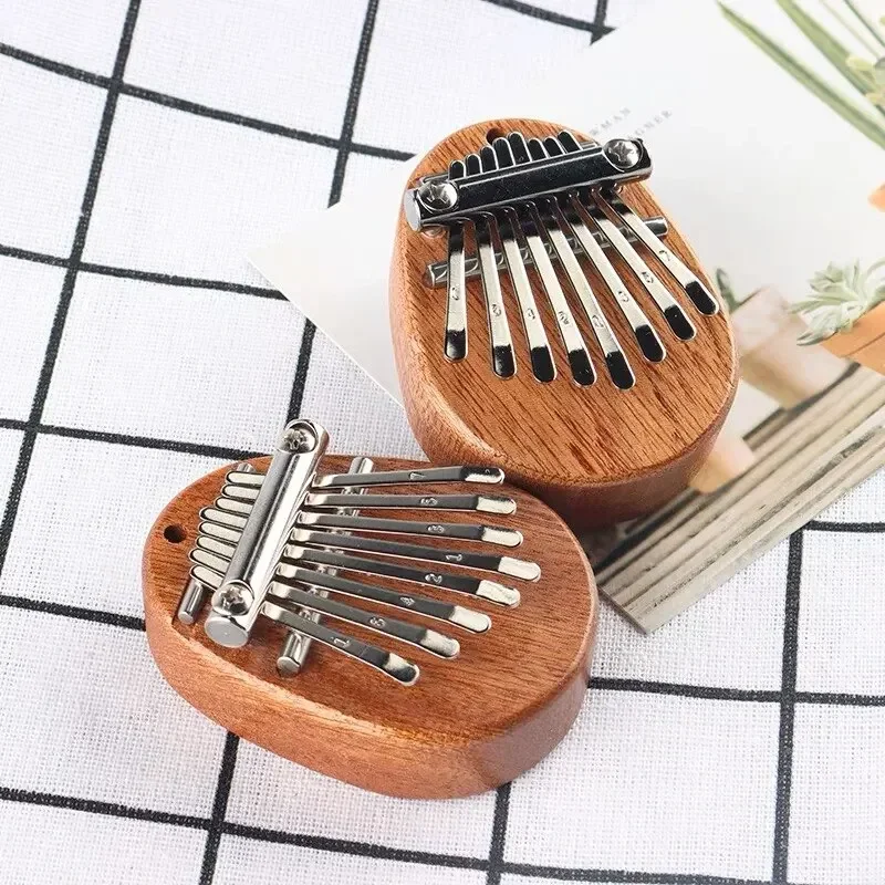 بيانو إصبع خشبي صغير بـ 8 نغما - مراجعة Musical Instrument Sounds وسعره